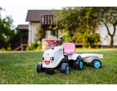 Falk Odstrkovadlo traktor Rainbow bielo ružový s volantom a vlečkou