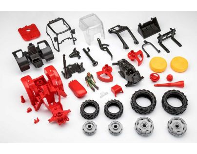 Revell Junior Kit traktor s figúrkou 1 : 20 červený