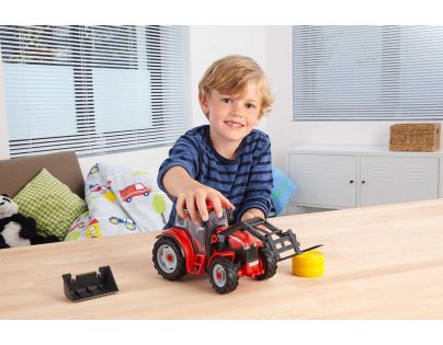 Revell Junior Kit traktor s figúrkou 1 : 20 červený